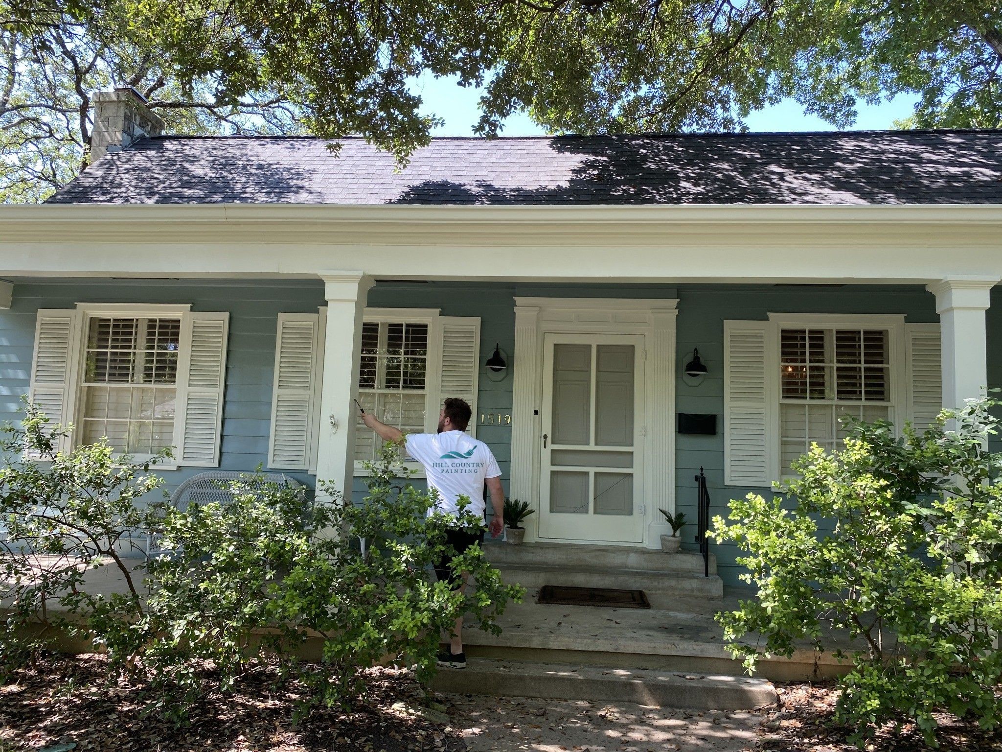 Hill Country Painting professional painter at work on Austin home